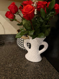 Heart and scroll double-handle white decorative vase styled with red roses